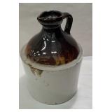 Brown and white jug with unusual top and drippy
