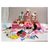 Group of Barbies and accessories with pink case