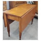 Early drop leaf table