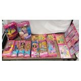 Group of retro Barbie dolls and accessories in