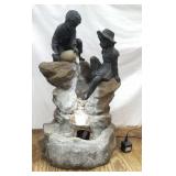 Fountain - 2 kids on rocks 
As is - Leg has a