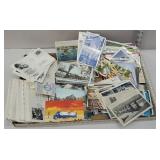 Piled full box of postcards and stamps