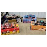 4 NASCAR diecast cars including Larry Pearson,