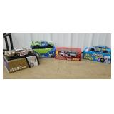 Top row of cart 21 - 4 NASCAR diecast cars