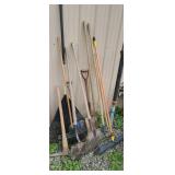 Group of yard tools, shovels, rakes, pick