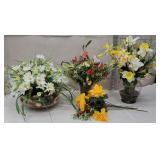 Group of artificial flowers in glass vases