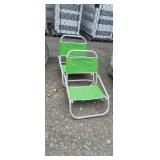 2 aluminum and green beach chairs with umbrella