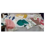 Box of retro linens including aprons