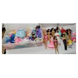 Plastic tub of Barbies and accessories