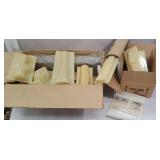 2 boxes of vintage candle molds