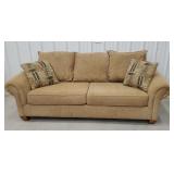 Tan couch with pillows