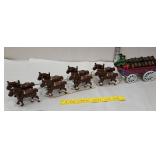 Cast iron beer wagon and horses with drivers and