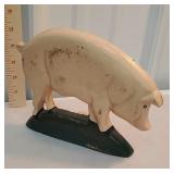 Cast iron pig door stop