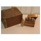 2 wooden boxes with little bottles