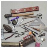 Box lot of misc tools, sad iron, hatchet, etc