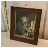 Oak frame with picture of man with a rat tail