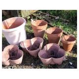 Pile of clay and plastic planters