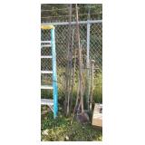 Pile of yard tools, tongs, hammers, digging bar,