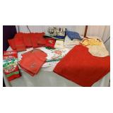 Large box of miscellaneous holiday linens, pot