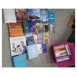 Pink crate of books including new photo