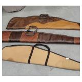 3 soft gun cases 2 leather, 1 cloth