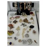Group of jewelry including many brooches and