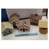 Four wooden houses and wishing well