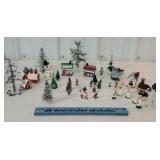 Box of tiny Christmas village pieces