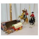 box of toys including covered wagon and horses