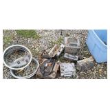 junk pile - old car radios and hub cap rings