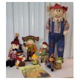 Box of fall decor scarecrows and flag