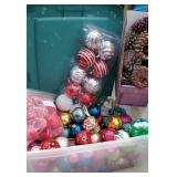 Clear plastic tub full of Christmas bulbs and