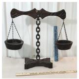Wooden balance scales with linked iron chain