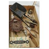 Spotlight includes cast iron wheelbarrow,