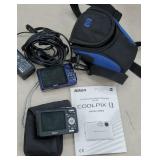2 digital cameras Nikon Coolpix and Canon