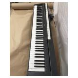 Yamaha P-71 digital piano w/ sustain pedal. Shows