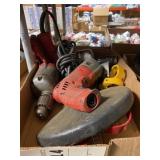 box of Milwaukee drills and guards