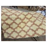 cream and rust patterned accent floor rug with non