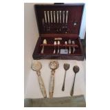 Silver plated flatware in wooden storage