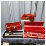 This practical lot features three red carry toolbo