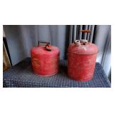 E5 - Two Metal Gas Cans Pair of metal gas cans. Th