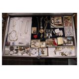 group of jewelry and collectible pins