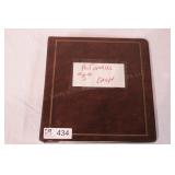 binder with vintage holiday postcards