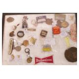 group of advertising pieces & badges