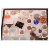 group of vintage plant badges and automotive items