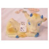 group of dairy bottle tops & rubber cow toy