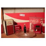 group of coca cola collectibles