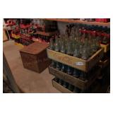 large group of coca cola bottles & bottle crates