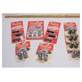 group of coca cola die cast cars