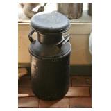 Black painted milk can